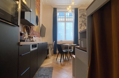 Flers Apartment | Studio in the Conciergerie of the former Banque de France in Flers.
