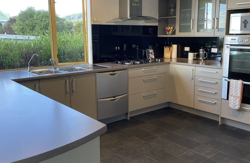 Pohara House | Stunning holiday home across the road to the beach