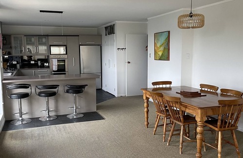 Pohara House | Stunning holiday home across the road to the beach