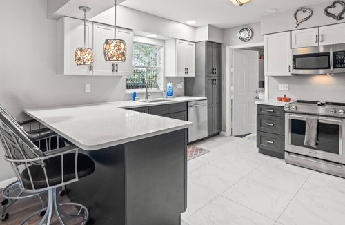 Riverview House | Stunning Inside and Out - Remodeled 3BR Riverfront Home with Hot Tub, Kayaks and Access to the Gulf