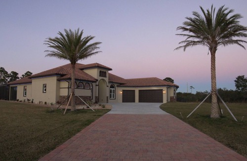 Grant-Valkaria House | Stunning Mediterranean-style vacation home w/ fabulous spillover hot tub/pool!
