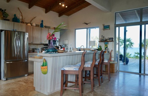 Savannah Sound House | Stunning, Private, Pink Sand, Beachfront Estate with 70ft dock on Bonefish Flats