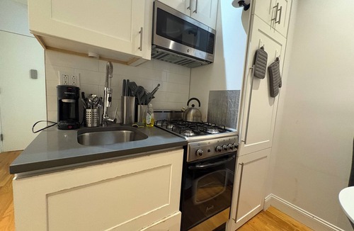 Central New York City Apartment | Stylish 2BR Midtown West Apartment w/Exposed Bric