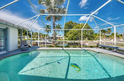 Caloosahatchee Villa | Stylish 4 BR/2 bath waterfront Villa with heated pool/bicycles