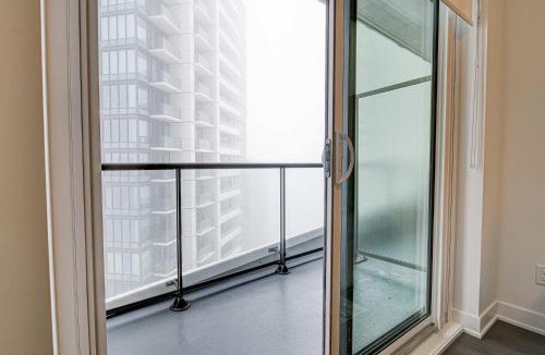 Kitchener House | Stylish Downtown Suite with Patio & City Views