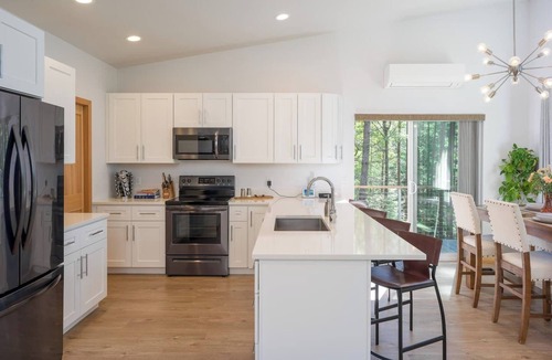 Rosario House | Stylish forest retreat on Orcas Island. Chef's kitchen, mid-century décor & a private deck among the firs. Two levels, forest views from every room. Minutes to Moran Park, Rosario Resort & Eastsound. Your perfect Pacific Northwest escape awaits.