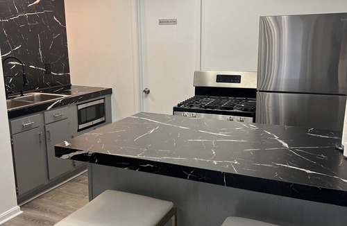 Highland Square Apartment | Stylish loft. Perfect for both travelers & event planners, alike!