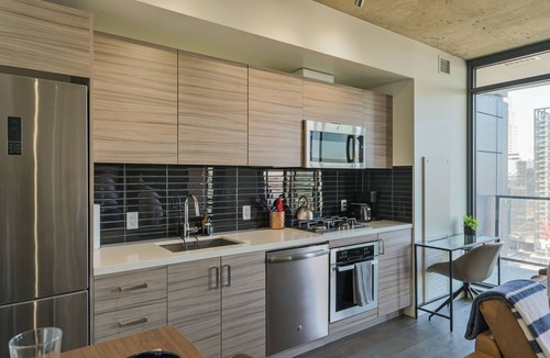 Connaught Condo | Stylish Modern w/ Heated Parking & Views of Skyline | Mins to Saddledome