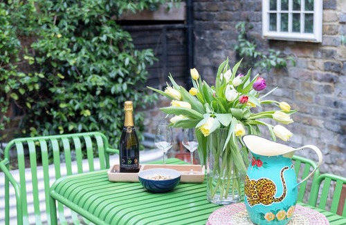 Harrow Road Apartment | Stylish newly renovated 2BR garden apartment in the heart of Maida Vale, featuring a bright open-plan living space, private courtyard terrace, fast WiFi, and excellent transport links. Just a short walk to multiple tube stations.