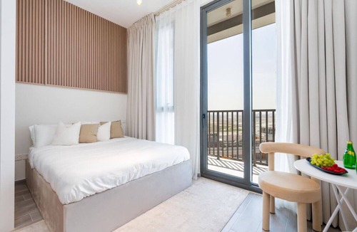 Dubai Production City Apartment | Stylish Noor 3 Studio with Poolside Views