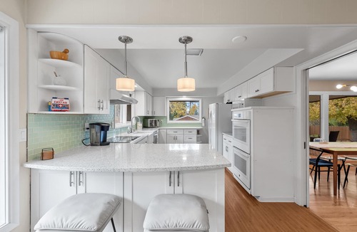 Moran Prairie House | Stylish South Hill Getaway | Bar & Game Room