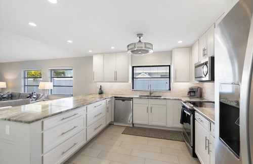 Naples Park House | SUMMER SPECIALS! Designer House, Heated Pool & Spa, close to beaches, FREE Bikes