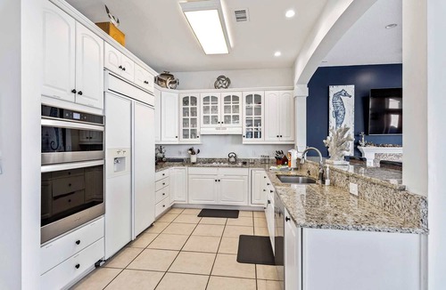 Holiday Isle House | Sun Kissed Home with Boat Dock, Pool & Tiki Cruise