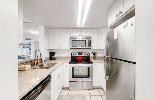 St. Augustine Beach Condo | Sunny ground-floor condo w/private patio, W/D, on-site pools, tennis court, BBQ