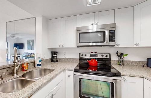 St. Augustine Beach Condo | Sunny ground-floor condo w/private patio, W/D, on-site pools, tennis court, BBQ