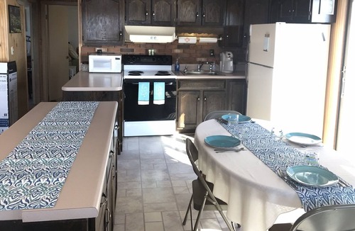 Town of Ledyard Cottage | Sunset Haven, lakefront on Cayuga Lake w/ Hot Tub, Waterslide & Boat Lift