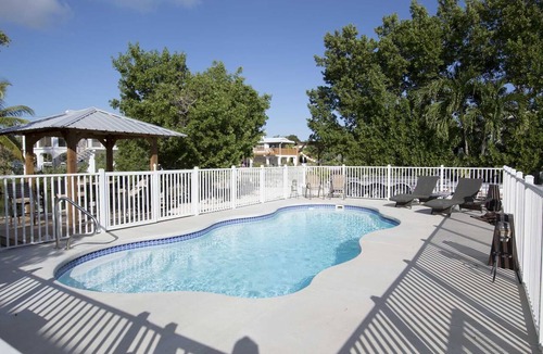 Port Pine Heights House | Sunset Hideaway, Pool home on canal