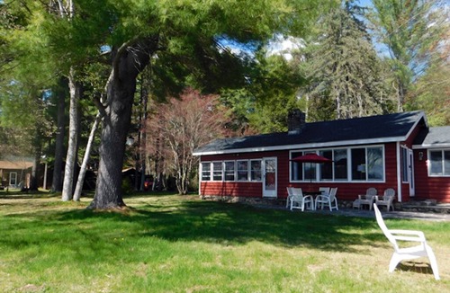 Naples Cottage | Sunset point waterfront home on with lots of outdoor space! Pet-friendly!