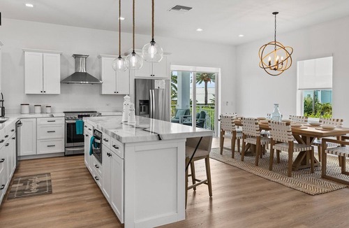 Coury House | Sunshine Getaway in Kcb Luxury Pool Home, 3BR 3BA Heated Pool Bikes Foosball Outdoor TV Pet-Friendly