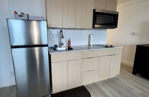 Downtown West Apartment | Sweet Landing,Pool, fitness room in Baltimore