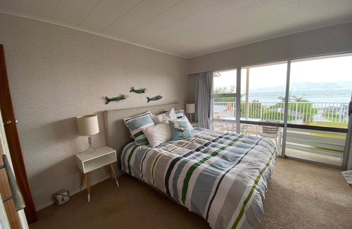 Te Kouma House | Te Kouma, Coromandel. Steps away from safe swimming beach and fishing access.