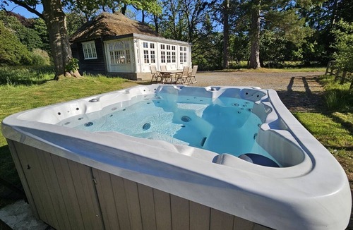 Thornton Hough Cottage | Thatched Pavilion including Hot Tub
