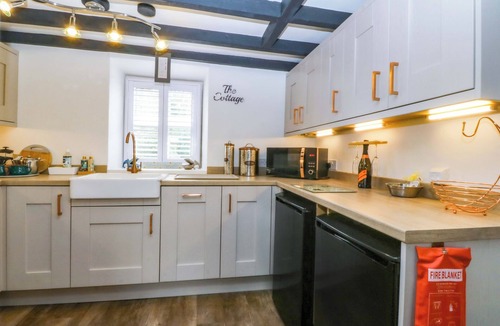 Marianglas Cottage | THE COTTAGE, pet friendly, with open fire in Marian-Glas