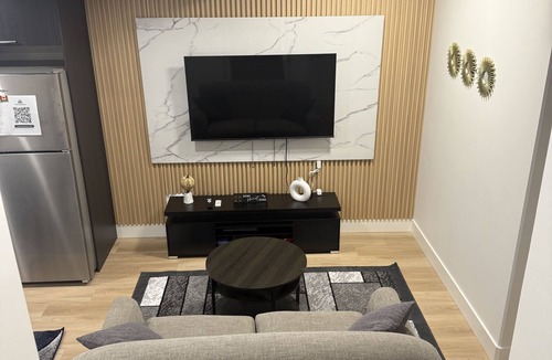 Northeast Edmonton House | The Cozy Parlor- a stylish and family-friendly space that feels just like home.