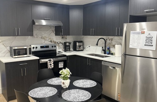 Northeast Edmonton House | The Cozy Parlor- a stylish and family-friendly space that feels just like home.