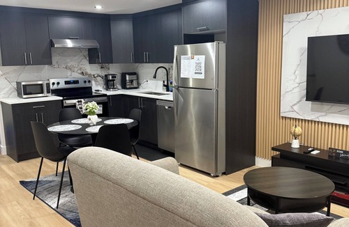 Northeast Edmonton House | The Cozy Parlor- a stylish and family-friendly space that feels just like home.
