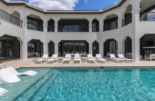 Reunion Villa | The Kingdom at Reunion | 12BR Luxe Mansion w/Themed Rooms, Private pool, and Theater Near Disney