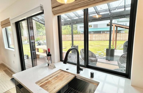 Mendenhall Valley House | The Seedling - outdoor gas fireplace, hot tub & grill near shops & trails