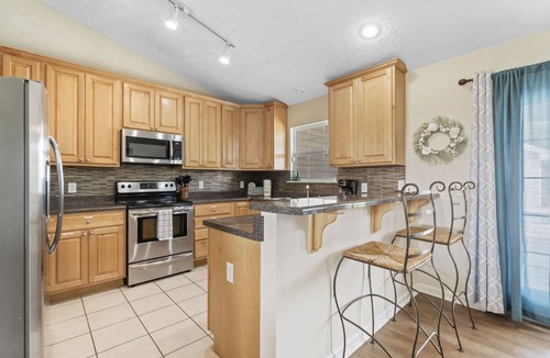 Lynn Haven House | The Splash Pad Sleeps 13 w Pool Patio and Garage