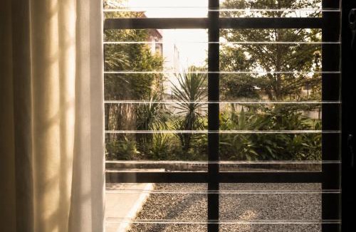 Bacolod Apartment | The Wittgenstein Project - Bauhaus Studio with Private Garden at Helvetia Heights