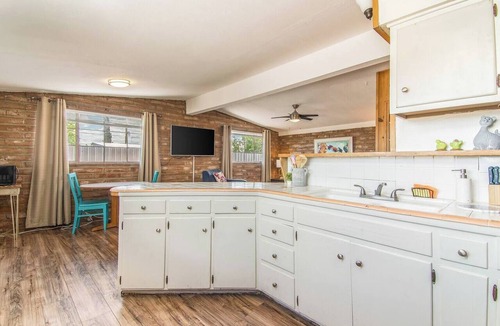 Midtown Apartment | This centrally located 1 bedroom features a full size pool and electric vehicle charging on site.