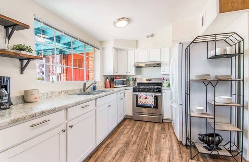 Midtown Apartment | This centrally located 3 bedroom 2 bathroom features a full size pool and electric vehicle charging on site.