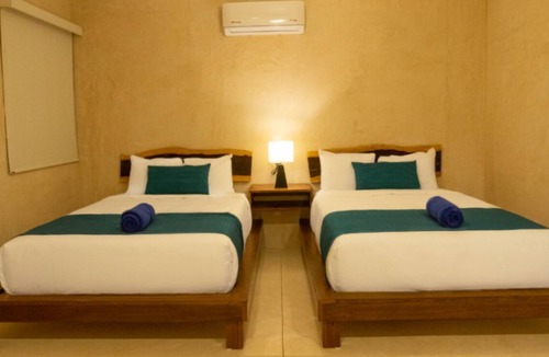 Zama Hotel | This comfortable room is a great option for a romantic escape in Tulum.