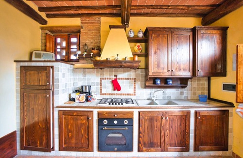 Montalcinello House | This ground floor house (55 sqm) consists of a living room with fireplace, satellite tv and kitchen