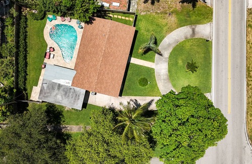 Lake Worth House | This modern 4-bedroom home sleeps 8 with 5 beds, 2 baths & a private pool.