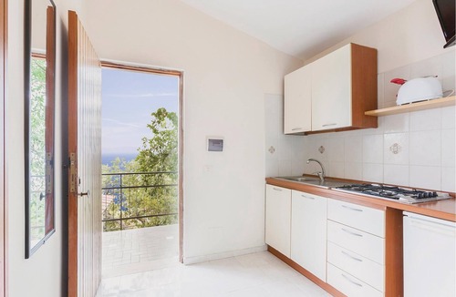 Monte Chiaro Apartment | This modern bungalow belongs to a vacation home complex directly above the sea, with a unique panora