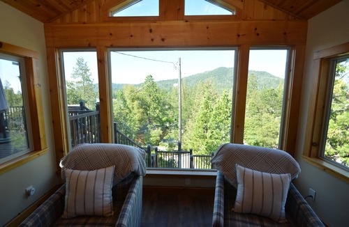 Bass Lake House | This multi-level lake area home has spacious outdoor covered and uncovered decking and a gas BBQ