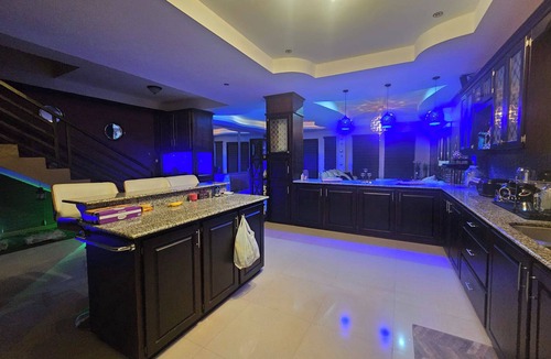 Claxton Bay House | This spacious property features a fully equipped kitchen, and an inviting small pool