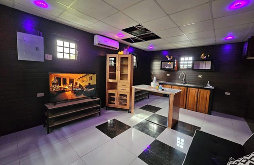 Claxton Bay Apartment | This spacious studio features a fully equipped kitchen, and an inviting small pool