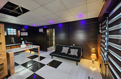 Claxton Bay Apartment | This spacious studio features a fully equipped kitchen, and an inviting small pool