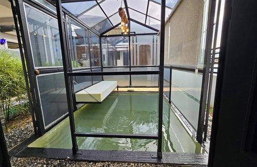 Claxton Bay Apartment | This spacious studio features a fully equipped kitchen, and an inviting small pool