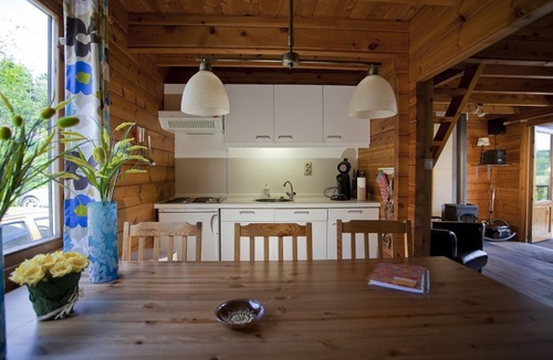 Bournoufay House | This spacious two-story wooden Finnish chalet accommodates up to 6 people across three comfortable bedrooms, making it perfect for larger families or holidays with friends.