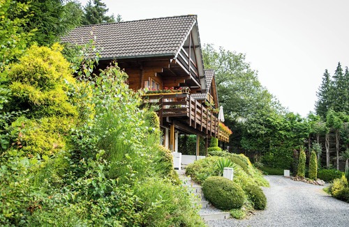 Bournoufay House | This spacious two-story wooden Finnish chalet accommodates up to 6 people across three comfortable bedrooms, making it perfect for larger families or holidays with friends.