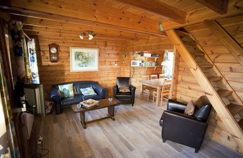Bournoufay House | This spacious two-story wooden Finnish chalet accommodates up to 6 people across three comfortable bedrooms, making it perfect for larger families or holidays with friends.
