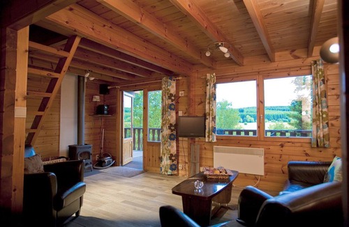 Bournoufay House | This spacious two-story wooden Finnish chalet accommodates up to 6 people across three comfortable bedrooms, making it perfect for larger families or holidays with friends.