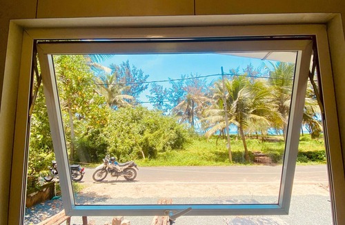 North Paravur House | This tiny home offers the perfect blend of modern comfort and seaside charm.
